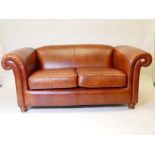 A John Lewis Derwent leather two seater sofa, 70" wide