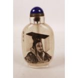 A Chinese reverse painted glass snuff bottle decorated with a portrait of a Chinese gentleman,