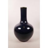 A Chinese deep blue glazed bottle vase, 13" high