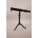 A reproduction brass desktop telescope on a tripod stand, engraved 'W. Ottway & Co. Ltd', 9" long