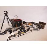 A quantity of 35mm SLR and half size cameras, including two Minolta SRT101, with adaptors and