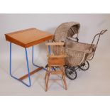 A child's plywood school desk together with a cane baby carriage and a beechwood doll's high