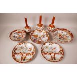 A collection of Japanese Meiji period Kutani porcelain comprising three bowls, largest 7"