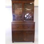 A C19th mahogany secretaire bookcase in the style of Gillow, with astragal glazed top over a
