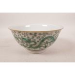 A Chinese porcelain rice bowl with green enamelled dragon decoration, 6 character mark to base,