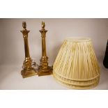A pair of brass Corinthian column table lamps from Laura Ashley, 19" high, with three silk shades