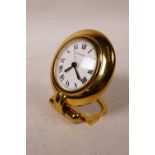 A Cartier 'Colisee' gold plated desk clock with a quartz movement, no.0568917, 3" diameter