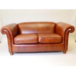 A John Lewis Derwent leather two seater sofa, 70" wide