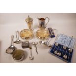 A small quantity of silver plated wares including a pair of pierced wine coasters, cream jug, set of