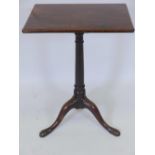 A Georgian mahogany ratchet top reading table on turned column and tripod supports, 28" high x 20" x