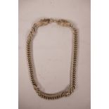 A Chinese white metal chain link necklace with dragon head decoration to ends, 25" long