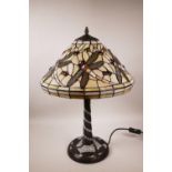 A Tiffany style table lamp with dragonfly decoration, 22½" high