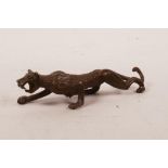 An Oriental bronze of a leopard, 4½" long