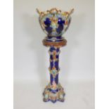 A Majolica Minton style jardiniere and stand, 50" high