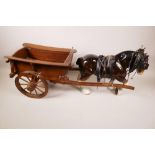 A large ceramic figurine of a shire horse and wooden cart, horse 10" high