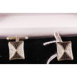 A pair of silver cufflinks set with cubic zirconium and marcasite
