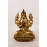 A Sino-Tibetan gilt bronze figure of a priest, double vajra mark to base, 8" high