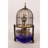 A brass birdcage automaton clock with skeleton movement, 7" high