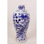 A Chinese blue and white porcelain baluster vase decorated with dragons amongst flowers, 4 character