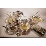 A large quantity of silver plated serving dishes, salvers, teapot, chocolate pots and other items