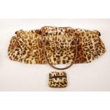 A vintage leopardskin handbag and purse