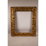 An antique carved giltwood frame, aperture size 18" x 14½"