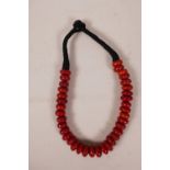 A red coral necklace, 20" long