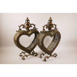 A pair of coppered metal heart shaped lanterns with reticulated sides, 12" x 18" high