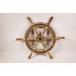 A vintage ship's wheel with bronze boss and mount, 20" diameter