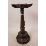 A North Indian bronze oil lamp, 9½" high