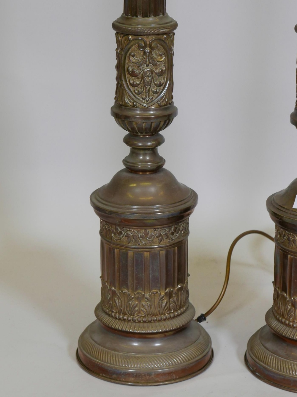 A pair of brass table lamps with repoussé classical decoration, 34" high - Image 2 of 2