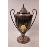 An Elkington and Co. tea urn, mid C19th, silver plated ovoid shape, high loop handles, ivory top A/