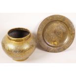 An Islamic brass vase with engraved script decoration, together with an Islamic brass dish on
