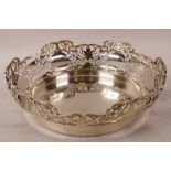 A hallmarked silver bread basket with pierced rim by Walker and Hall, Sheffield, hallmarked 1933 (