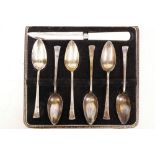 A set of six sterling silver grapefruit spoons with a stainless steel grapefruit knife, hallmarked