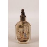 A Chinese reverse painted glass snuff bottle with erotic decoration, inscription verso, 3½" high