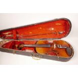 A vintage violin with two piece back and rosewood finger board, in a fitted wooden case, with bow,