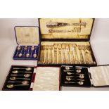 A boxed set of hallmarked silver handled fish servers and eaters (Sheffield 1924), together with