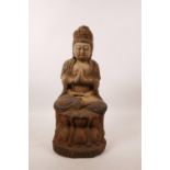 A Chinese carved and painted wood figure of Buddha, seated in meditation on a lotus throne, 14" high