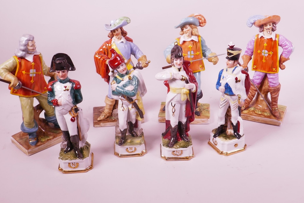 Four Continental porcelain figurines of d'Artagnan, and The Three Musketeers, 8" high, together with