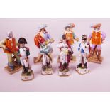 Four Continental porcelain figurines of d'Artagnan, and The Three Musketeers, 8" high, together with