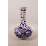 A Chinese blue and white squat form vase decorated with temple dogs highlighted with red, 8" high