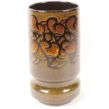 A Poole Pottery Aegean pattern cylindrical vase with floral decoration on a dark brown glaze, 9½"