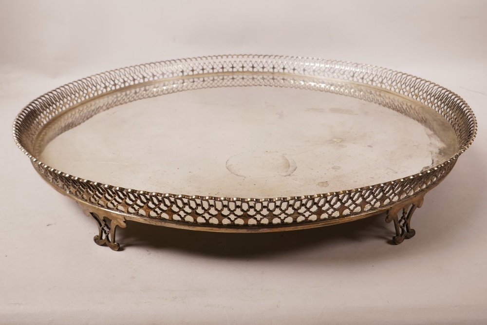 An antique Portuguese silver tray with pierced gallery and six supports, marked JRO and X1, and on