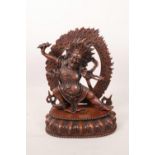 A Sino-Tibetan coppered metal figure of a wrathful deity, impressed double vajra mark to base, 7½"