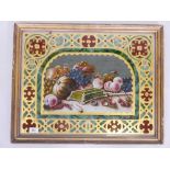 A C19th eglomise and reverse painted still life of fruit, with Gothic revival decoration, in a