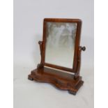 A Victorian mahogany swing toilet mirror, 19½" x 19½", 22" high