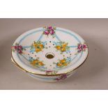 A C19th porcelain two part sponge dish decorated with garlands and roses, retailed by Thomas Goode &