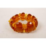 An amber and amber style bead bracelet, 3" diameter