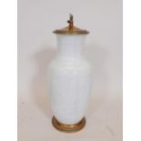 A celadon glazed porcelain table lamp with brass mounts, 20" high